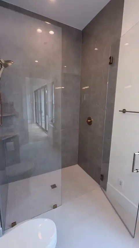 Curbless glass shower with large-format porcelain